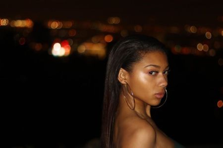 Sierra Capri with a black hair poses in front of the camera.